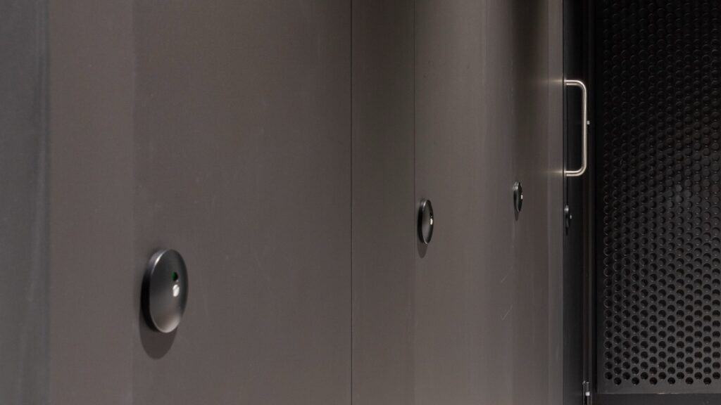 Full height Identity cubicles in office washroom