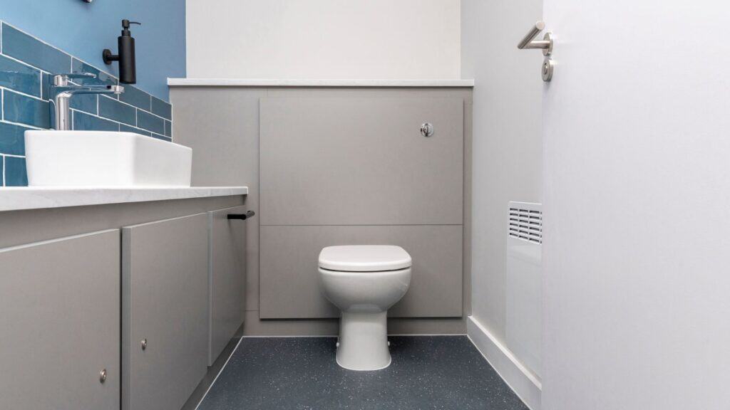 Universal Toilet with half-height duct panels.
