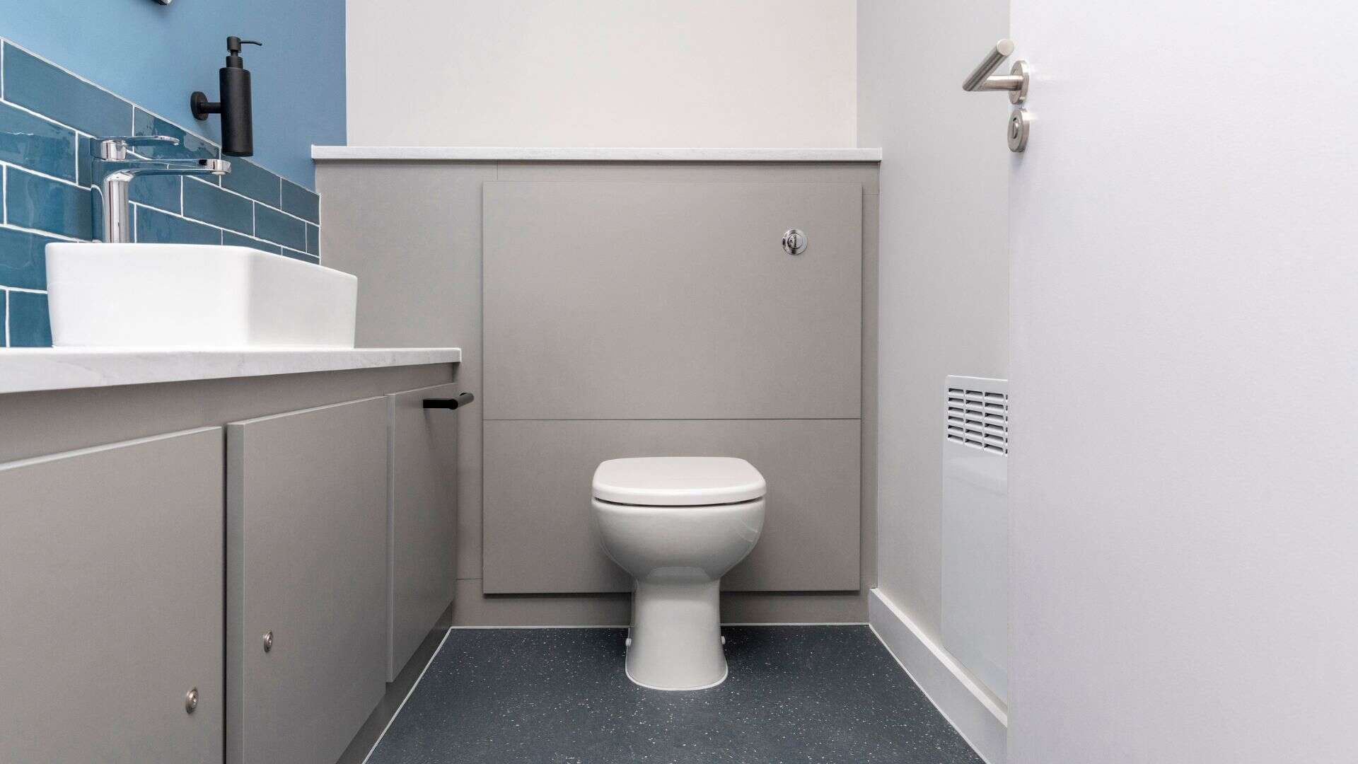 Universal Toilet with half-height duct panels.