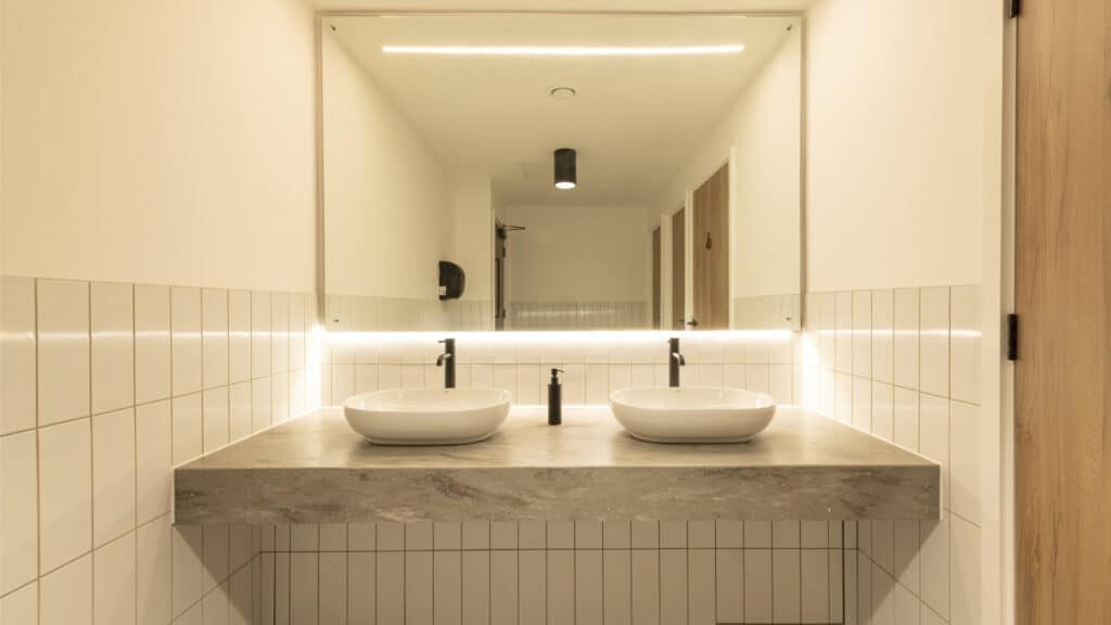 2 table top sinks on a floating solid surface vanity top
